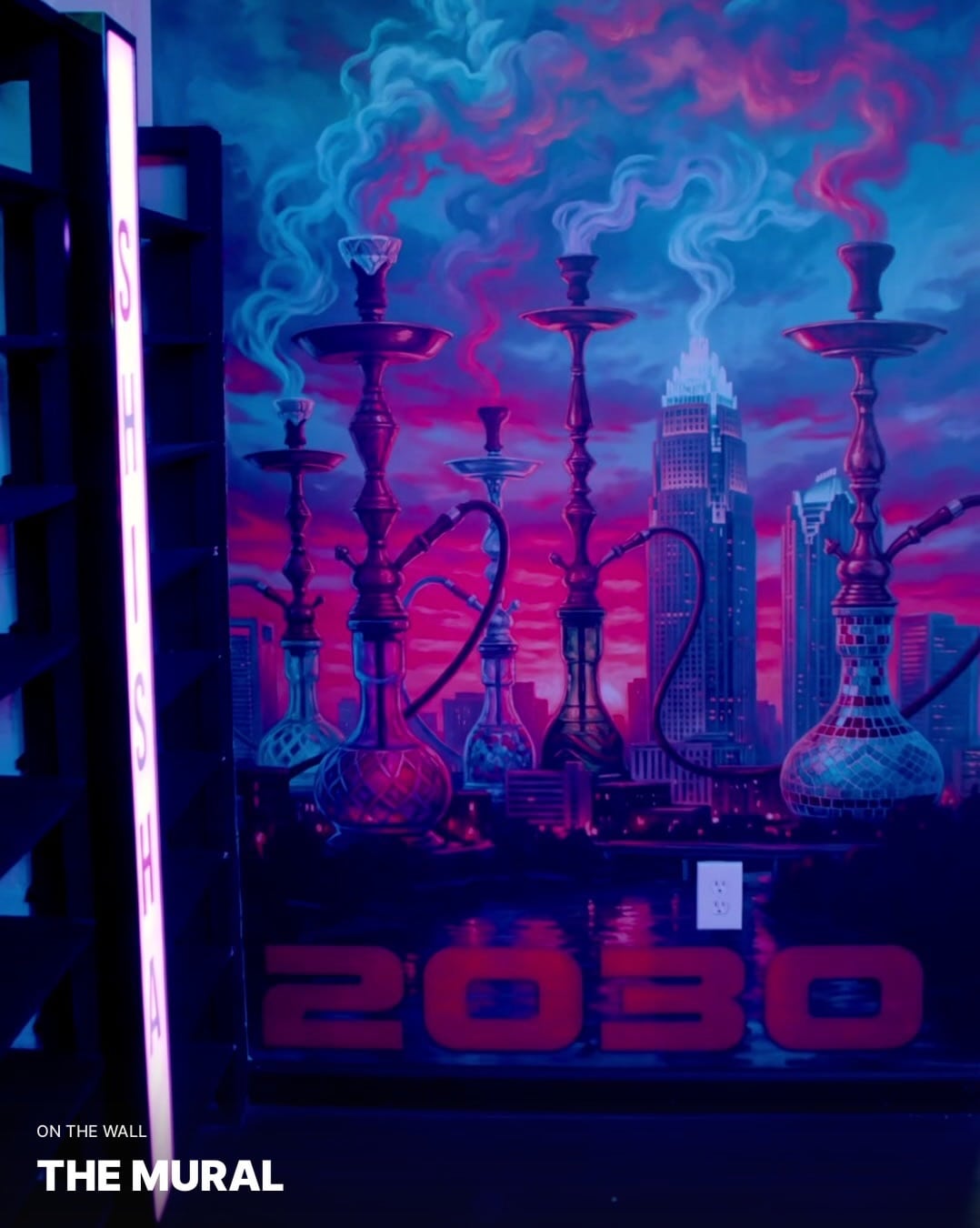 Hookah mural with a city skyline and blue and pink lighting inside Zona Verde.